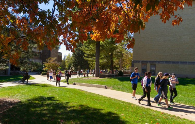 Students walking outside on a campus