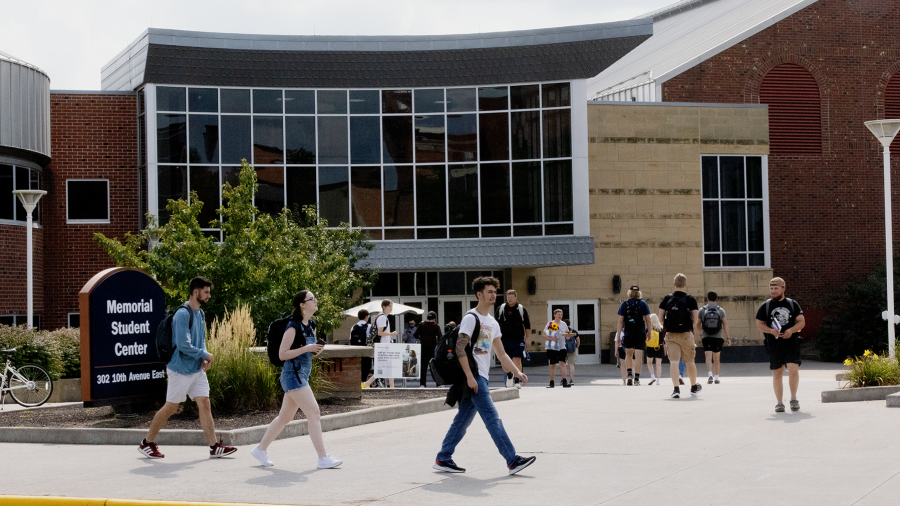 Photo of UW-Stout students passing by the Memorial Student Center. / UW-Stout